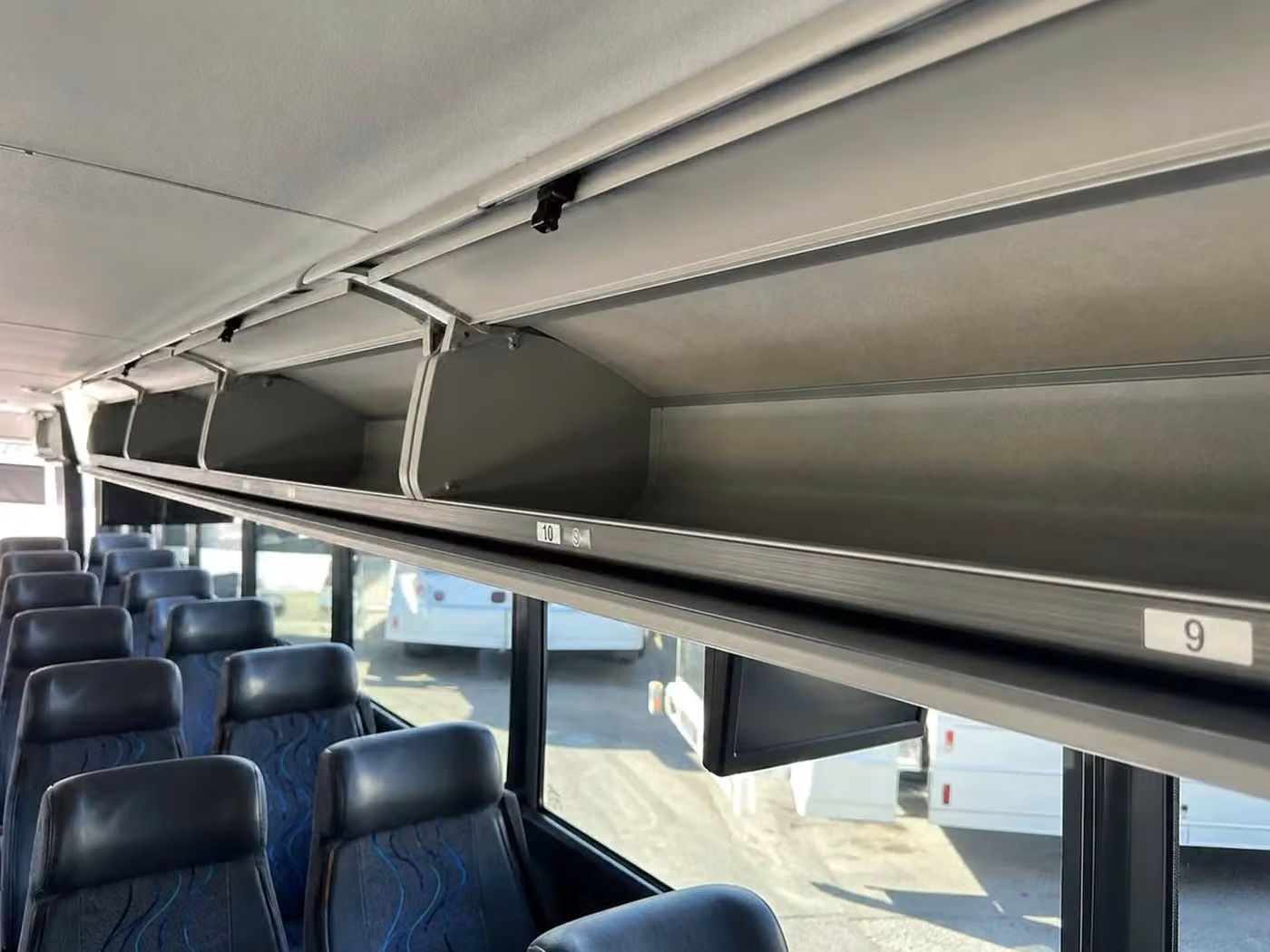 oviedo 56 passenger charter bus overhead storage